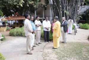 Brahmachari Achyutananda speaks with a group of devotees.
