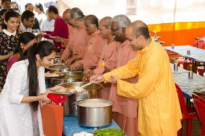 Monks serve a special lunch to initiates after the diksha ceremony.