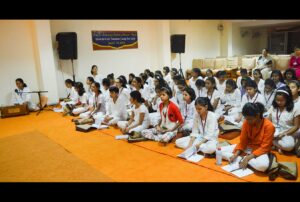 Girls join in chanting and meditation twice a day.