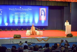 Swami Smaranananda is introduced to audience at NIC talk, Pune.