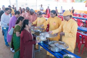 Monks serve a special meal to new Kriya initiates.