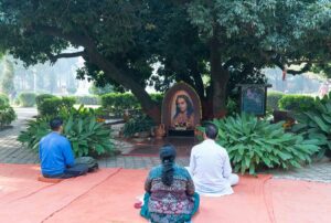 Devotees meditate below Litchi Vedi…