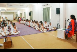 Girls attentively listen to “Why and How to Meditate.”