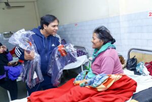 Blanket distribution in hospital ward, Lucknow.