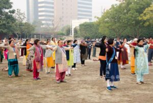 Devotees join in the group Energization Exercises…