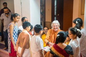 Children greet Swamiji after performing a skit based on Gurudeva’s story on the saint Sri Chaitanya .