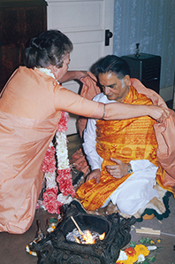 Sri Daya Mata drapes the ochre cloth of sannyas on Swami Shyamananda, Mother Centre, 1970