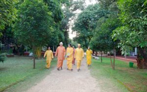 With monks, ashram grounds.