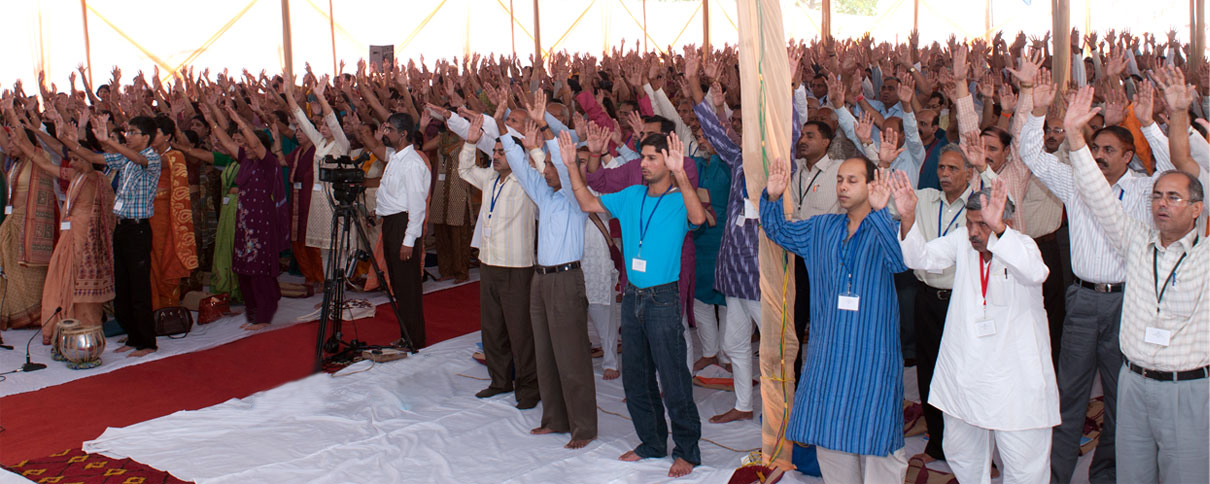 Devotees at YSS performing healing prayers in Worldwide Prayer Circle.