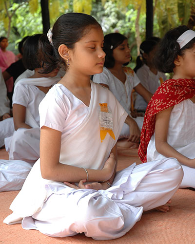 Girl child meditating.