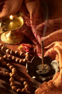Diya and incense used in prayers.