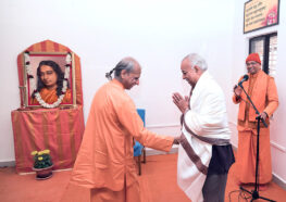 Swami Suddhananda felicitates the contractor of the project.