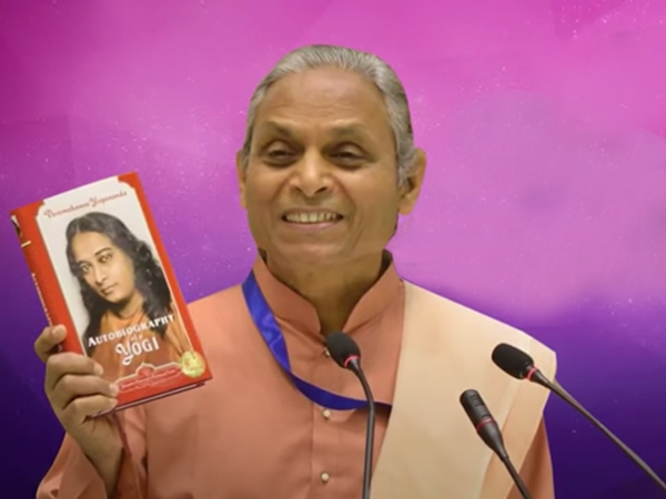 Swami Smaranananda with Autobiography of a Yogi