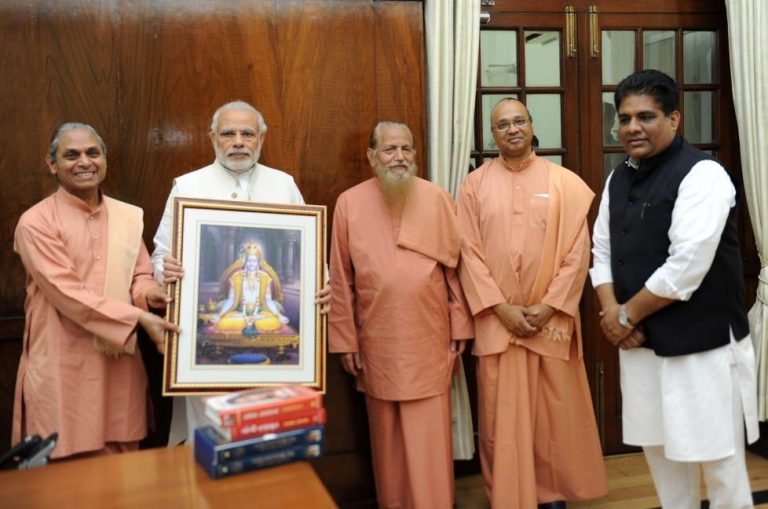 YSS monks presents Bhagavan Krishna's Picture to Narendra Modi