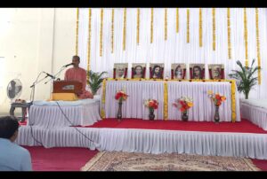 Swami Sadananda leads a day's programme at Porbandar where...