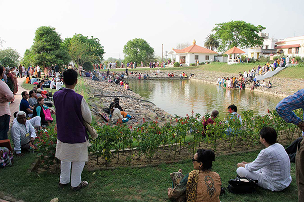 Devotees around the pond in Dihika ashram.